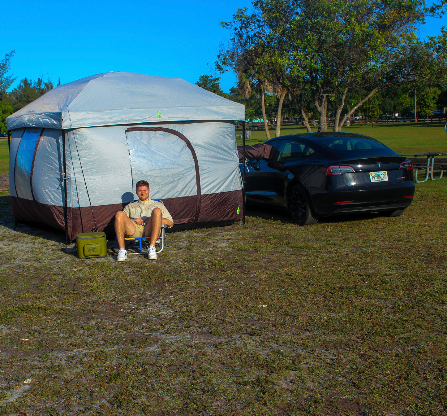 Tesla tent setup with Model Y for EV camping adventures. Perfect Tesla tent for electric vehicle camping gear setups. Designed for Tesla Model 3 and Model Y camping, this tent is ideal for outdoor experiences and car camping solutions. Enhance your Tesla camping setup with this versatile and easy-to-use tent for electric vehicle road trips.