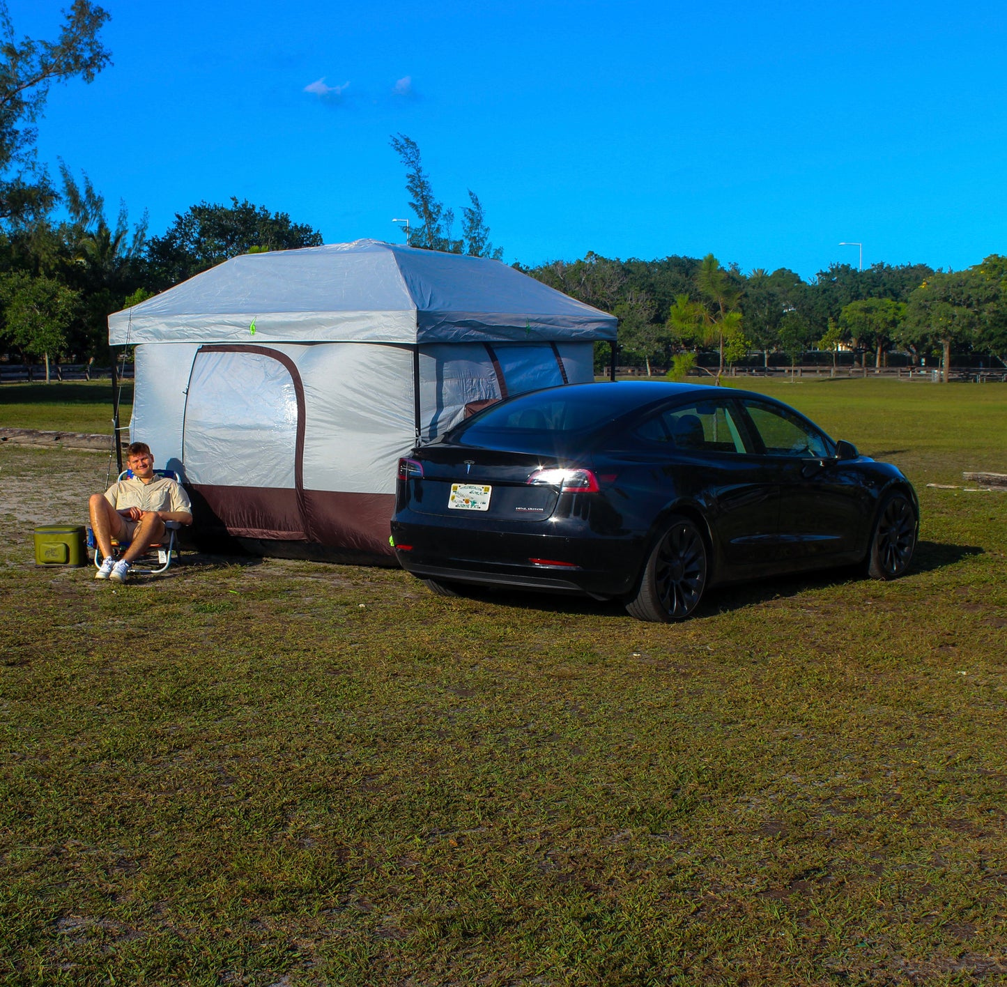 Tesla tent setup with Model Y for EV camping adventures. Perfect Tesla tent for electric vehicle camping gear setups. Designed for Tesla Model 3 and Model Y camping, this tent is ideal for outdoor experiences and car camping solutions. Enhance your Tesla camping setup with this versatile and easy-to-use tent for electric vehicle road trips.