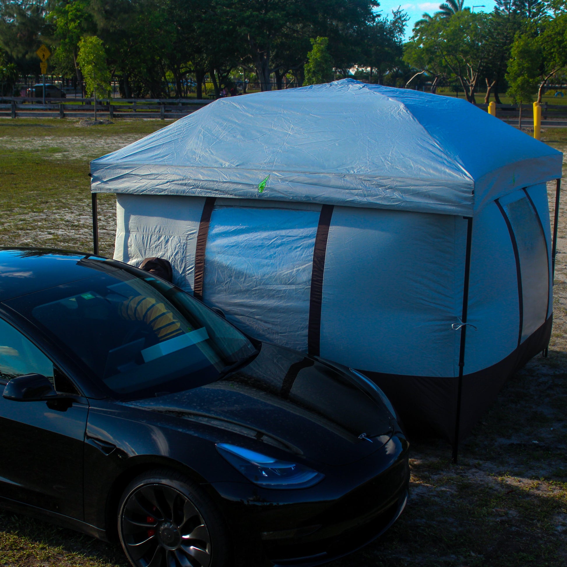 Tesla tent setup with Model Y for EV camping adventures. Perfect Tesla tent for electric vehicle camping gear setups. Designed for Tesla Model 3 and Model Y camping, this tent is ideal for outdoor experiences and car camping solutions. Enhance your Tesla camping setup with this versatile and easy-to-use tent for electric vehicle road trips.